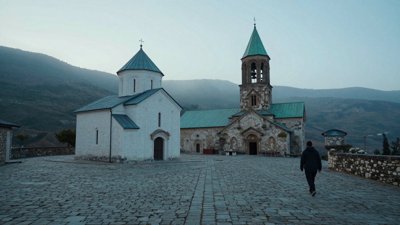 Whitewashed chapel and bell tower in a misty monastery courtyard at dawn, one figure walking away