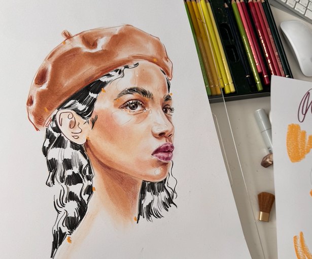 Colored pencil portrait of a woman in a terracotta beret beside pencils and brushes