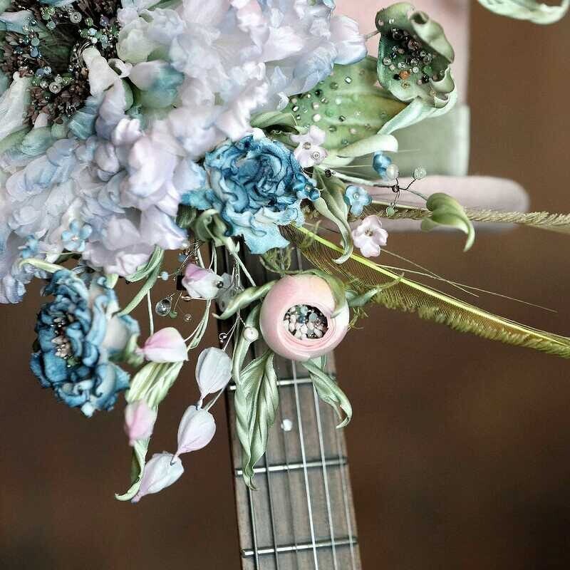 White and blue silk peony arrangement with blue roses, pink buds, beads and feathers